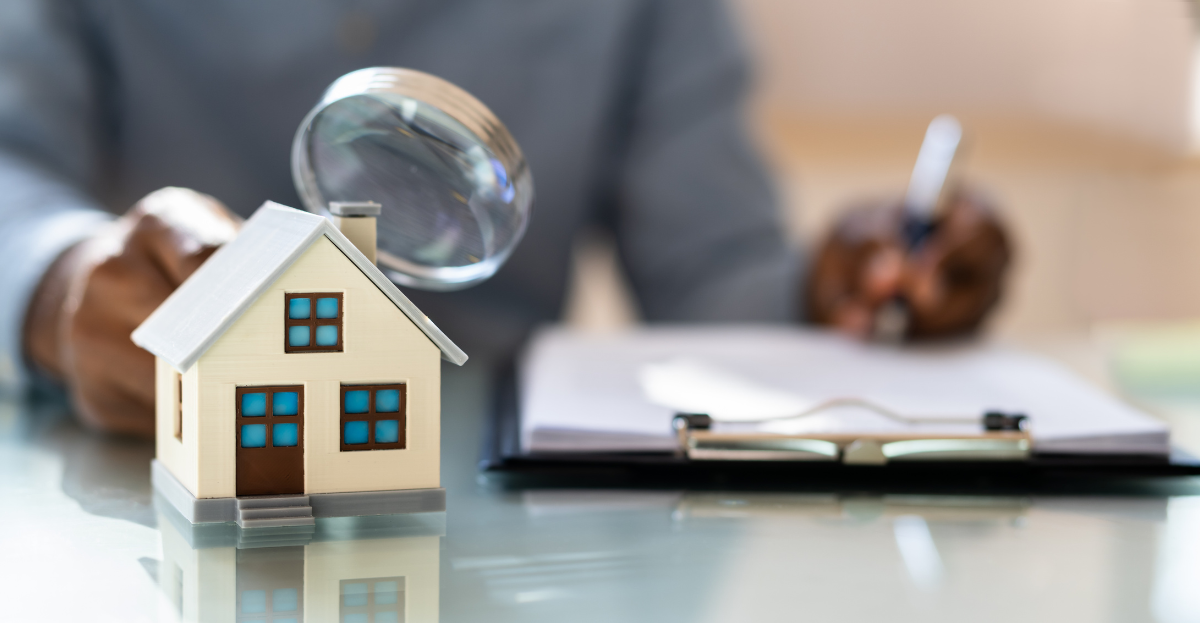 A toy house and a glass.