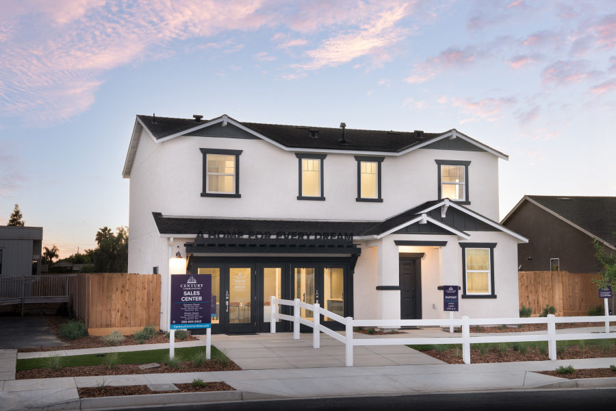 A house with a white picket fence.