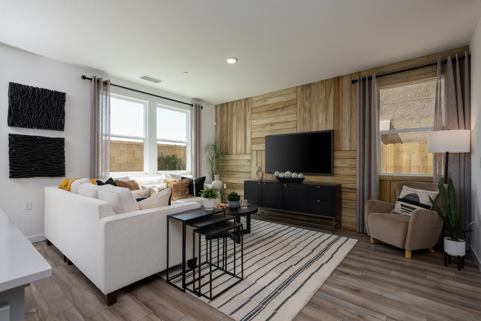 A living room with a tv and couches.