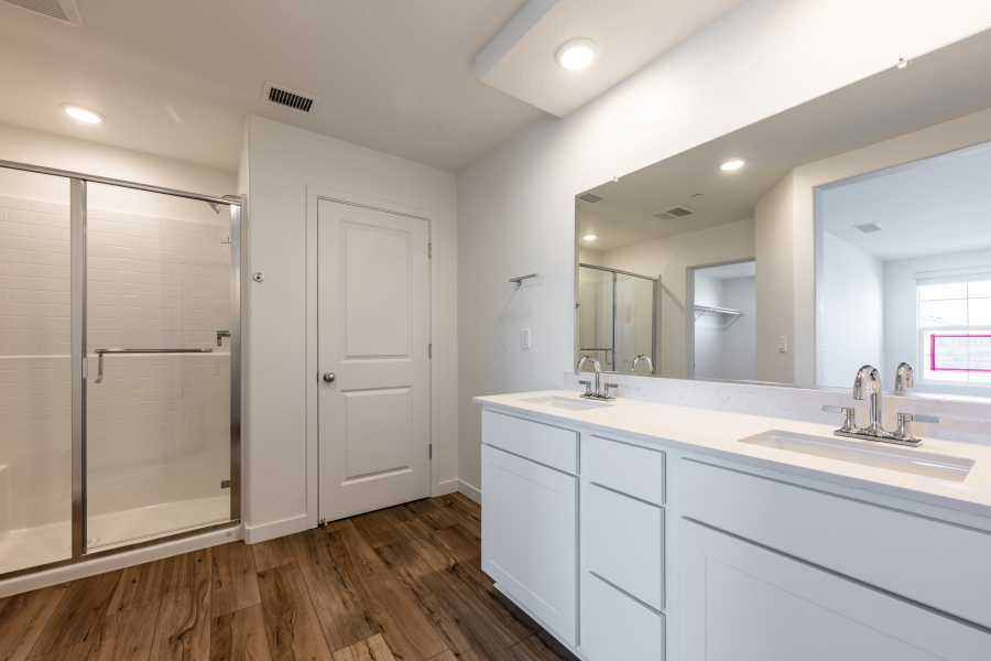 A bathroom with a glass shower.
