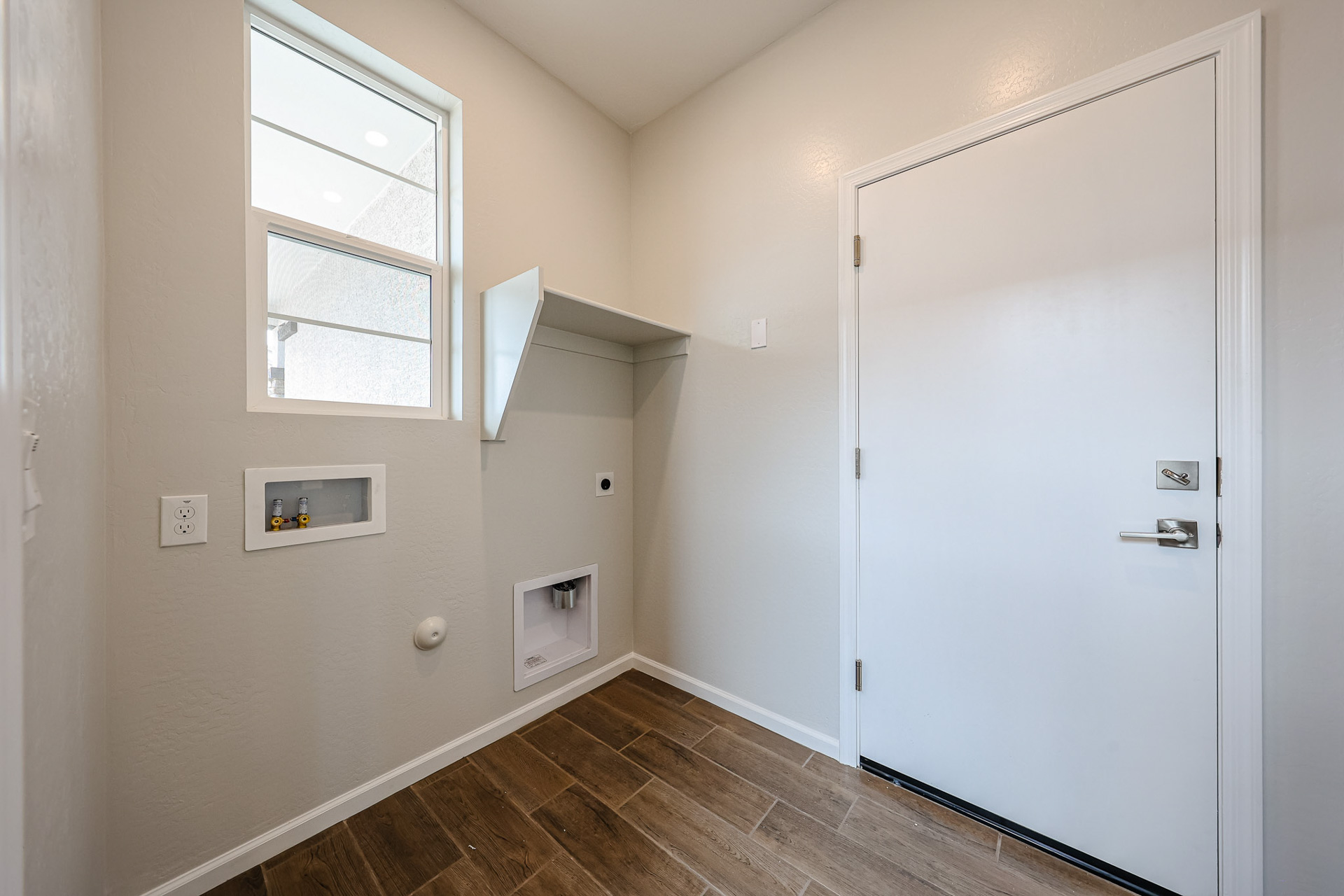 A room with a door and a window.