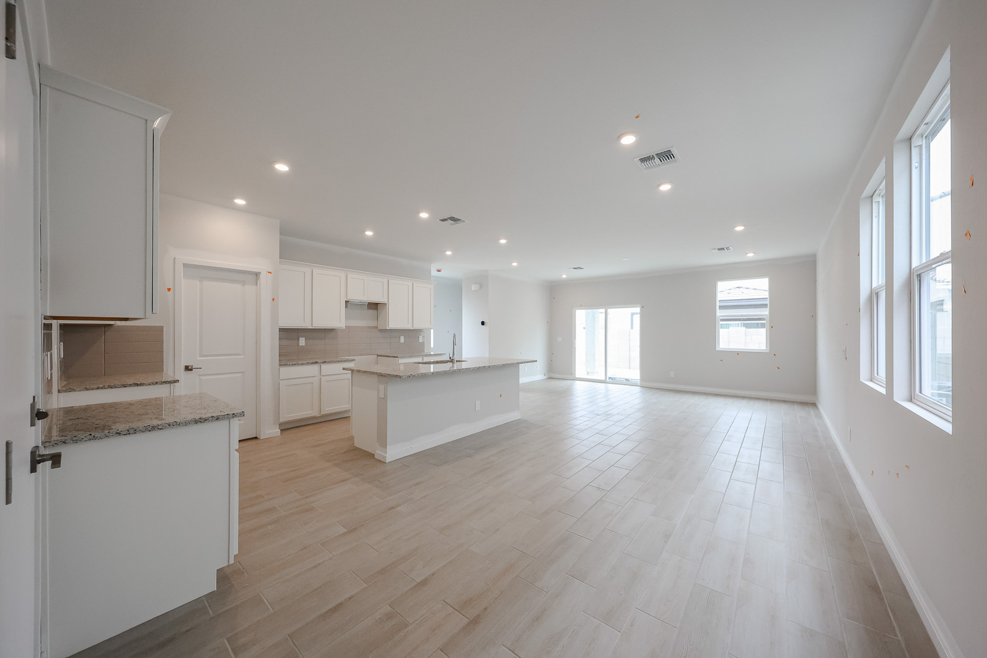 A large kitchen with white cabinets.