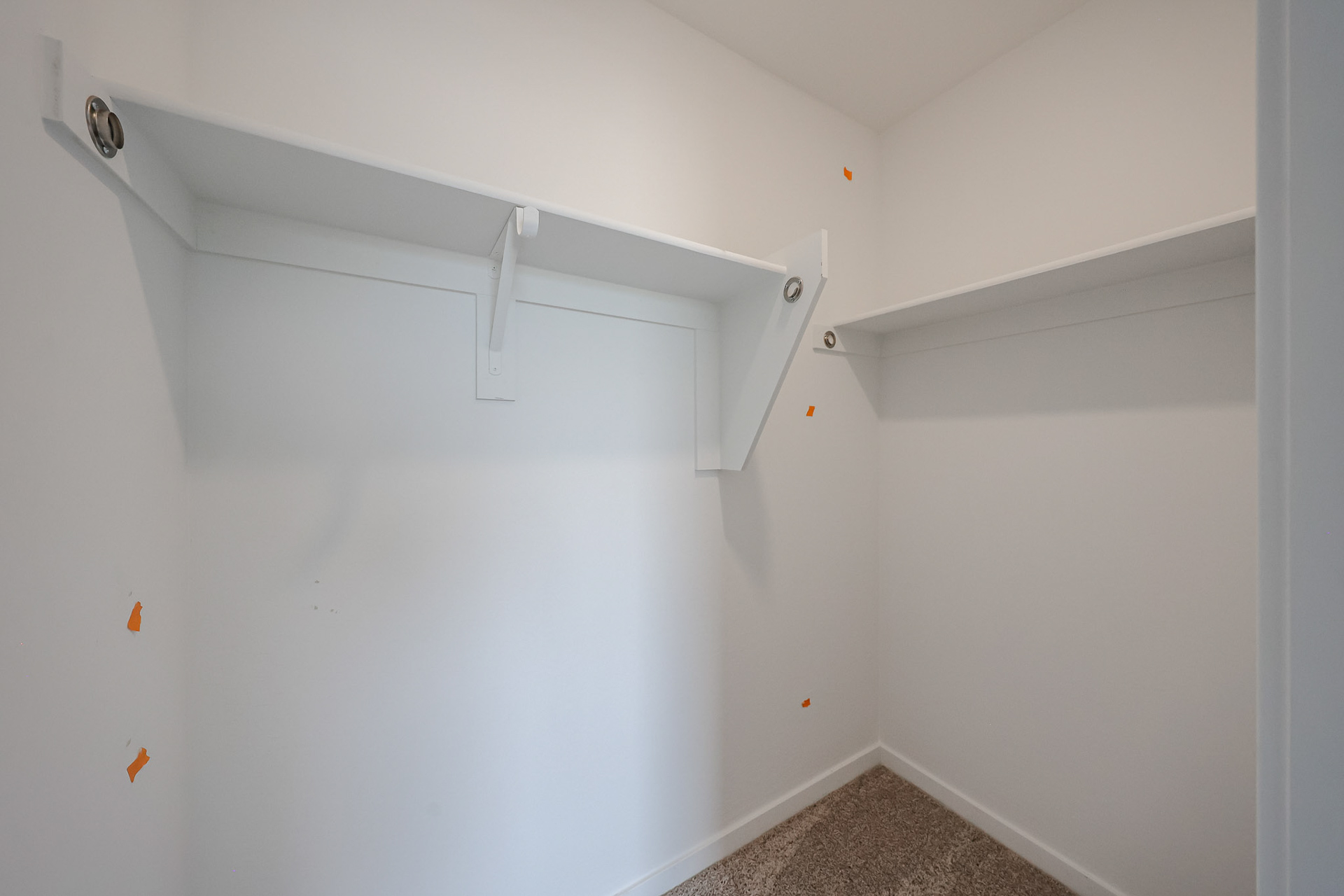 A white wall with a vent.