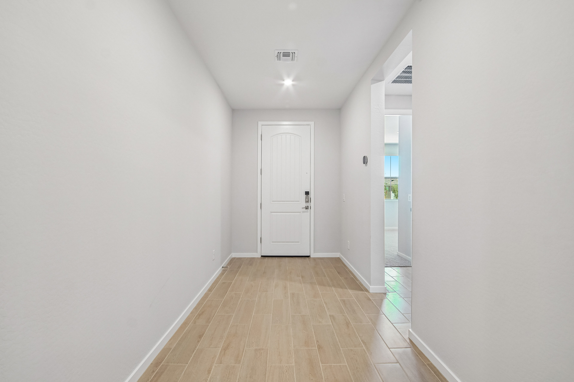 A hallway with white doors.
