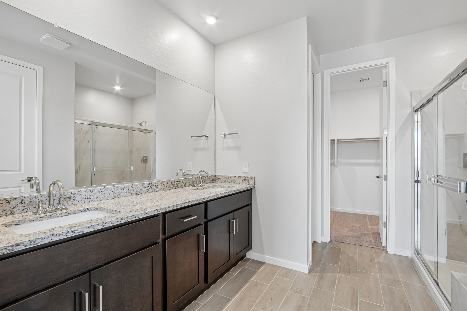 A bathroom with a marble countertop.