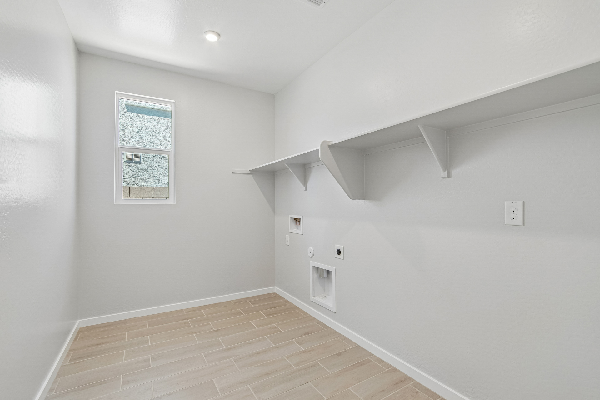 A hallway with white walls.