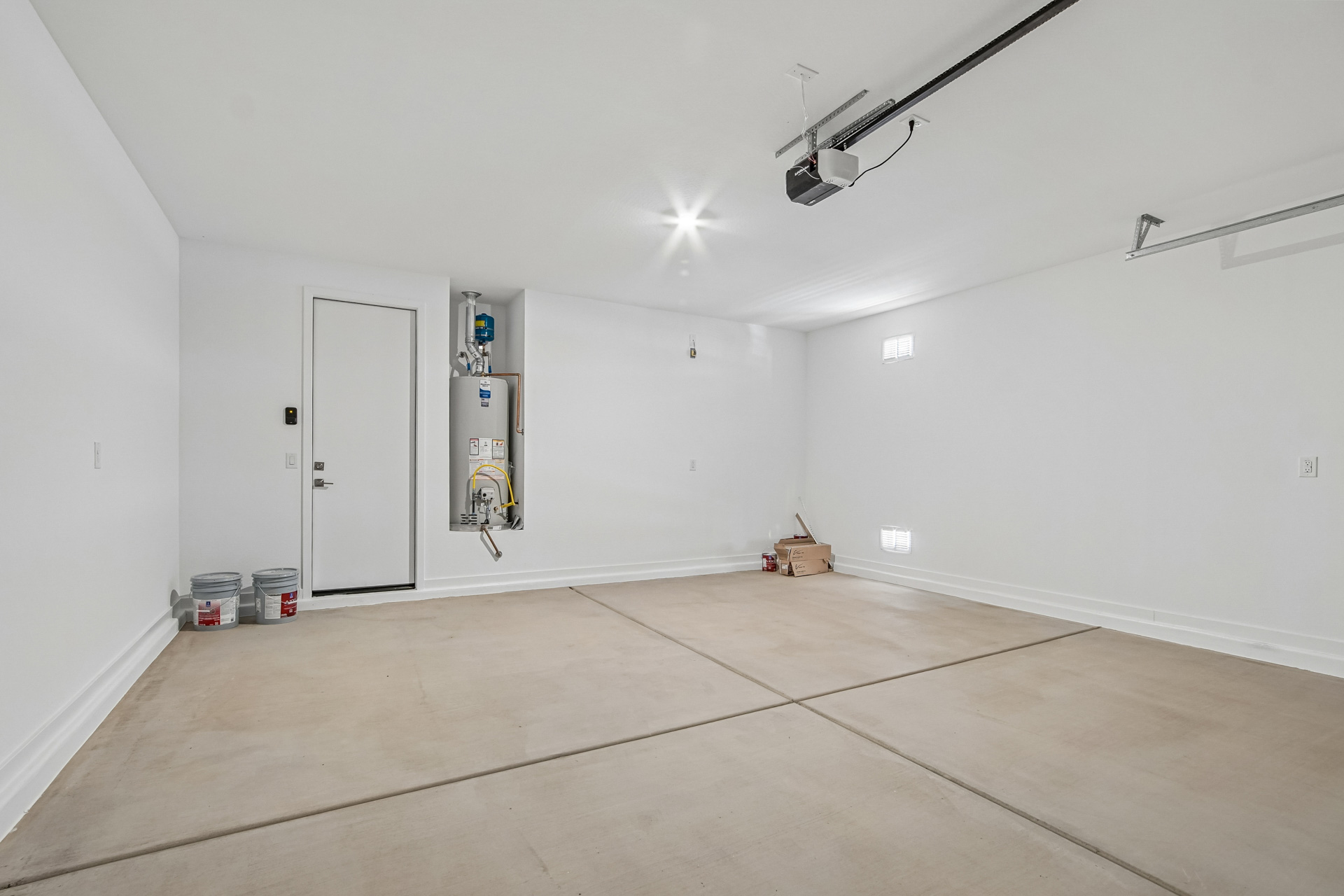 A room with white walls and a white door.