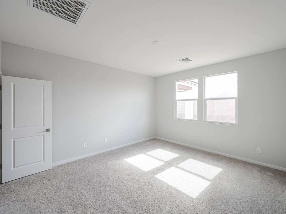 A room with white walls and a white door.