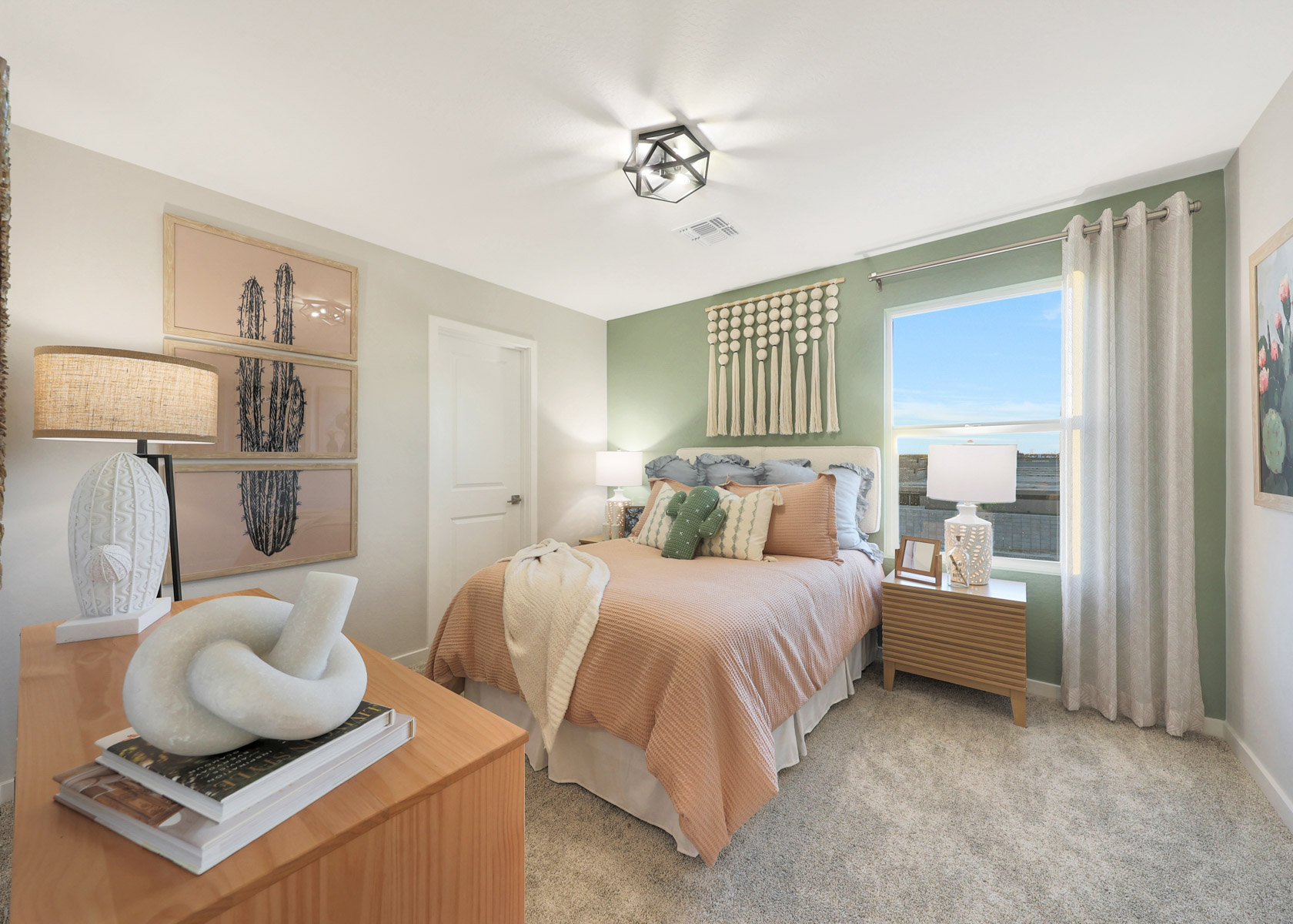 A bedroom with a bed and a table.