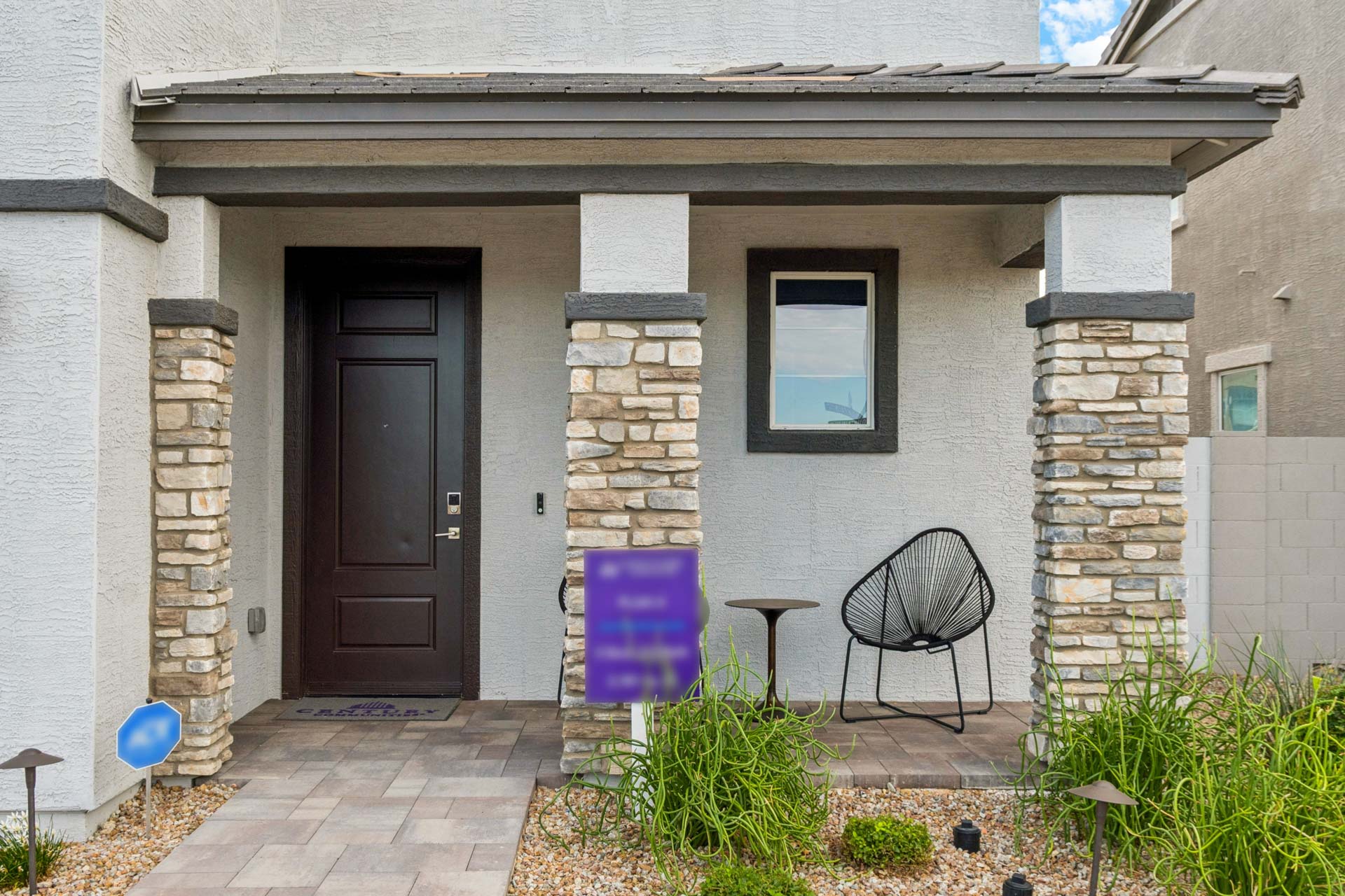 A house with a chair and a door.