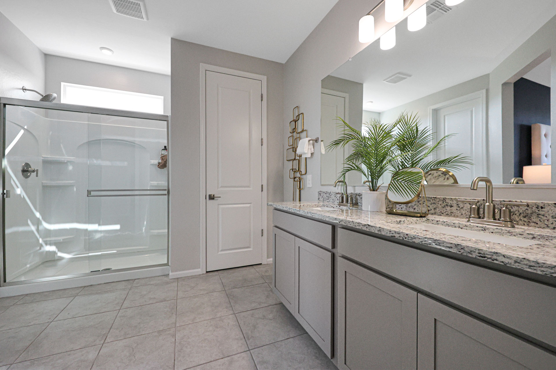 A bathroom with a marble countertop.