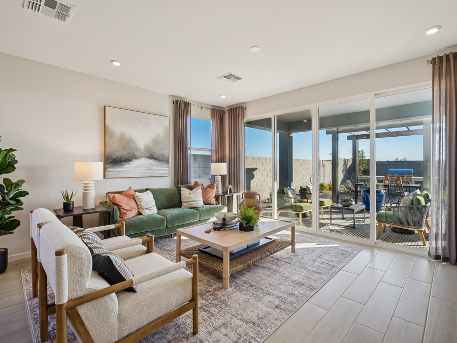 A living room with a large glass door.