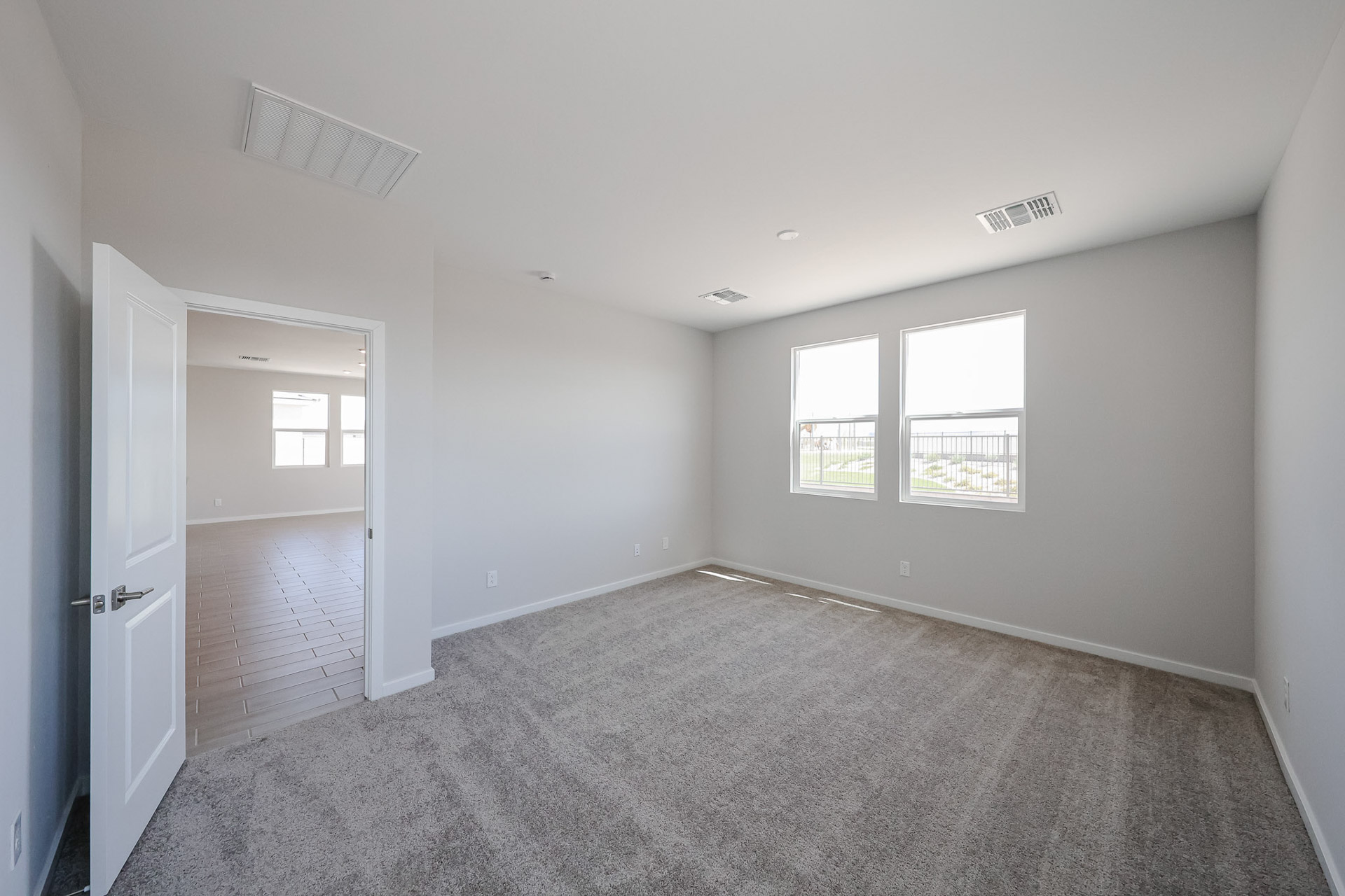 A room with a door and windows.