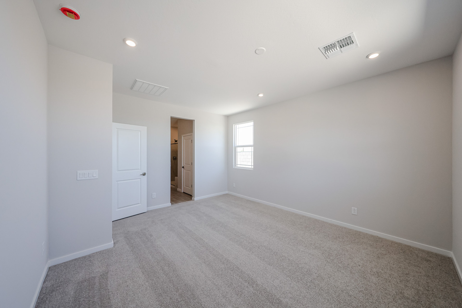 A hallway with white walls.