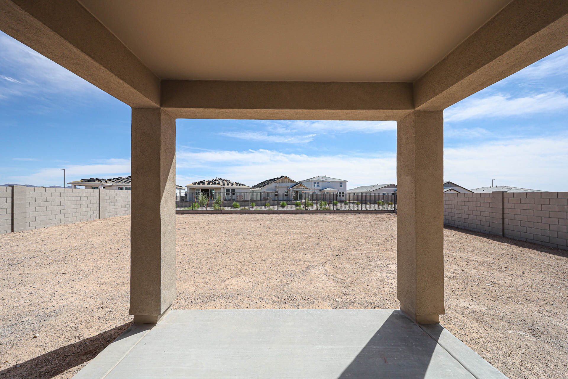 A view of a beach and buildings from a window.