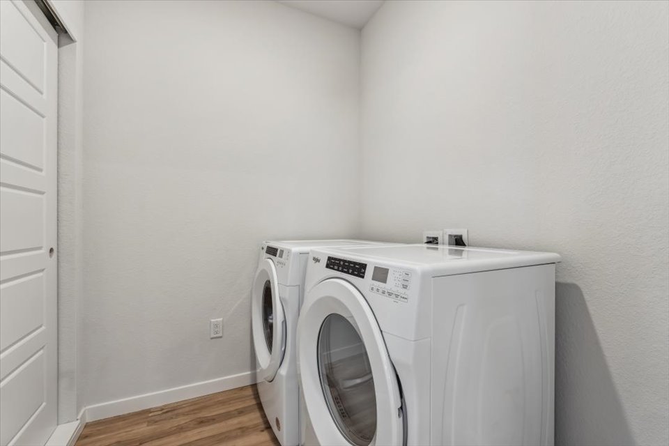 A white washing machine in a room.