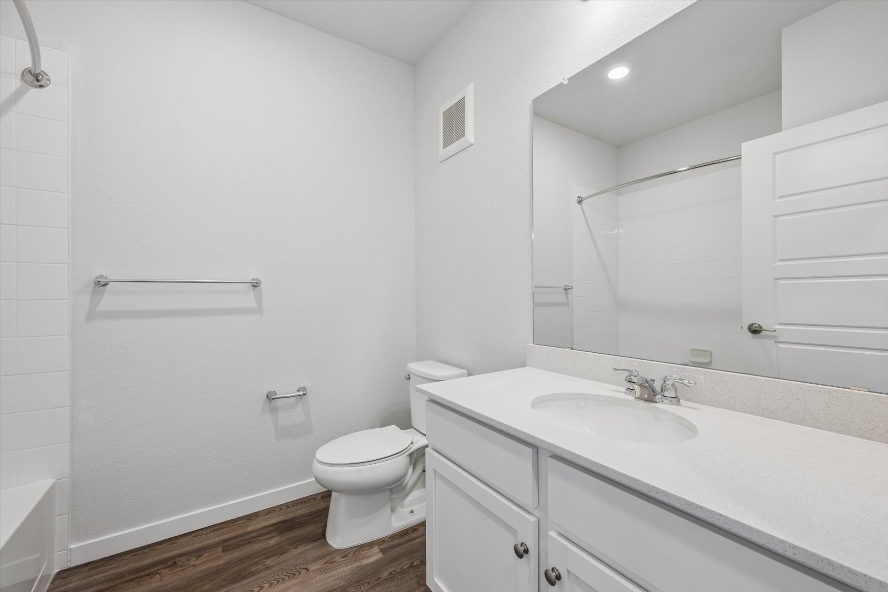 A bathroom with a sink toilet and shower.