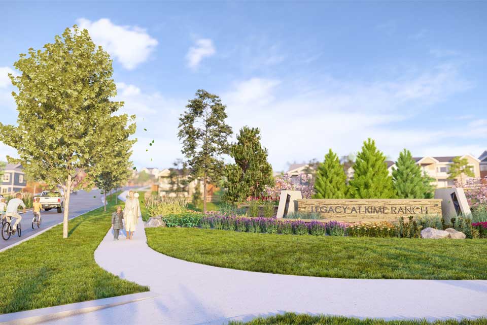 A path with a wall and trees on the side.