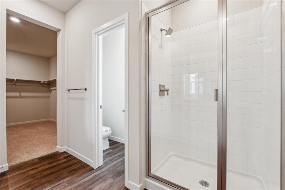 A bathroom with a glass shower.