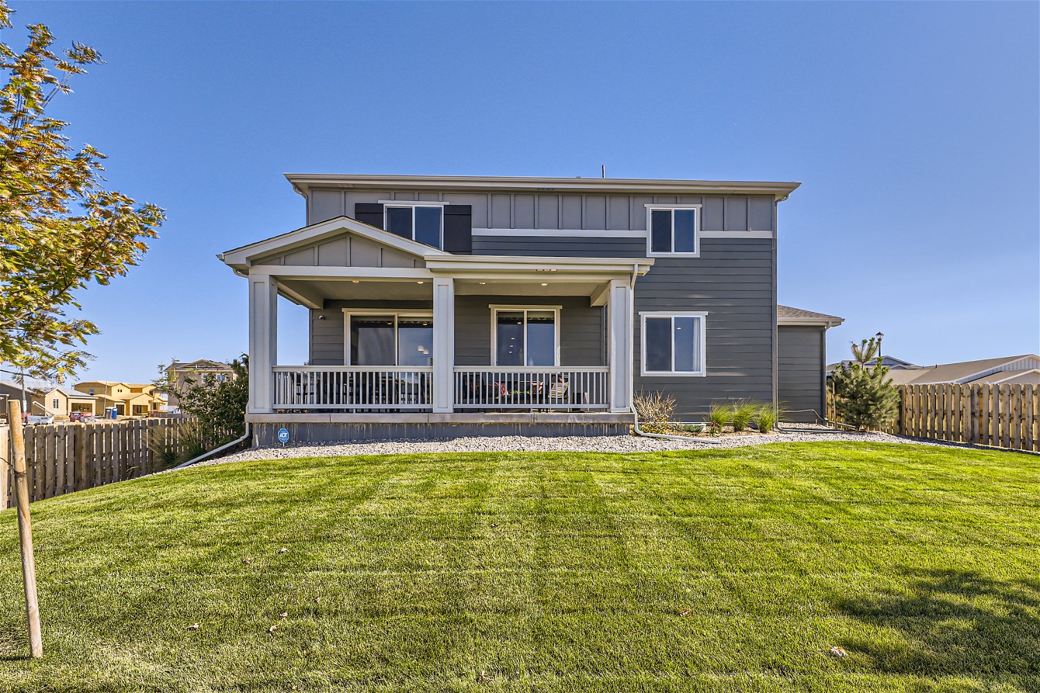 A house with a lawn in front of it.