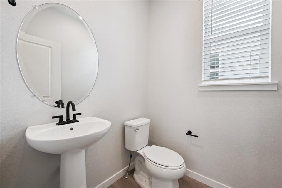 A bathroom with a sink and toilet.