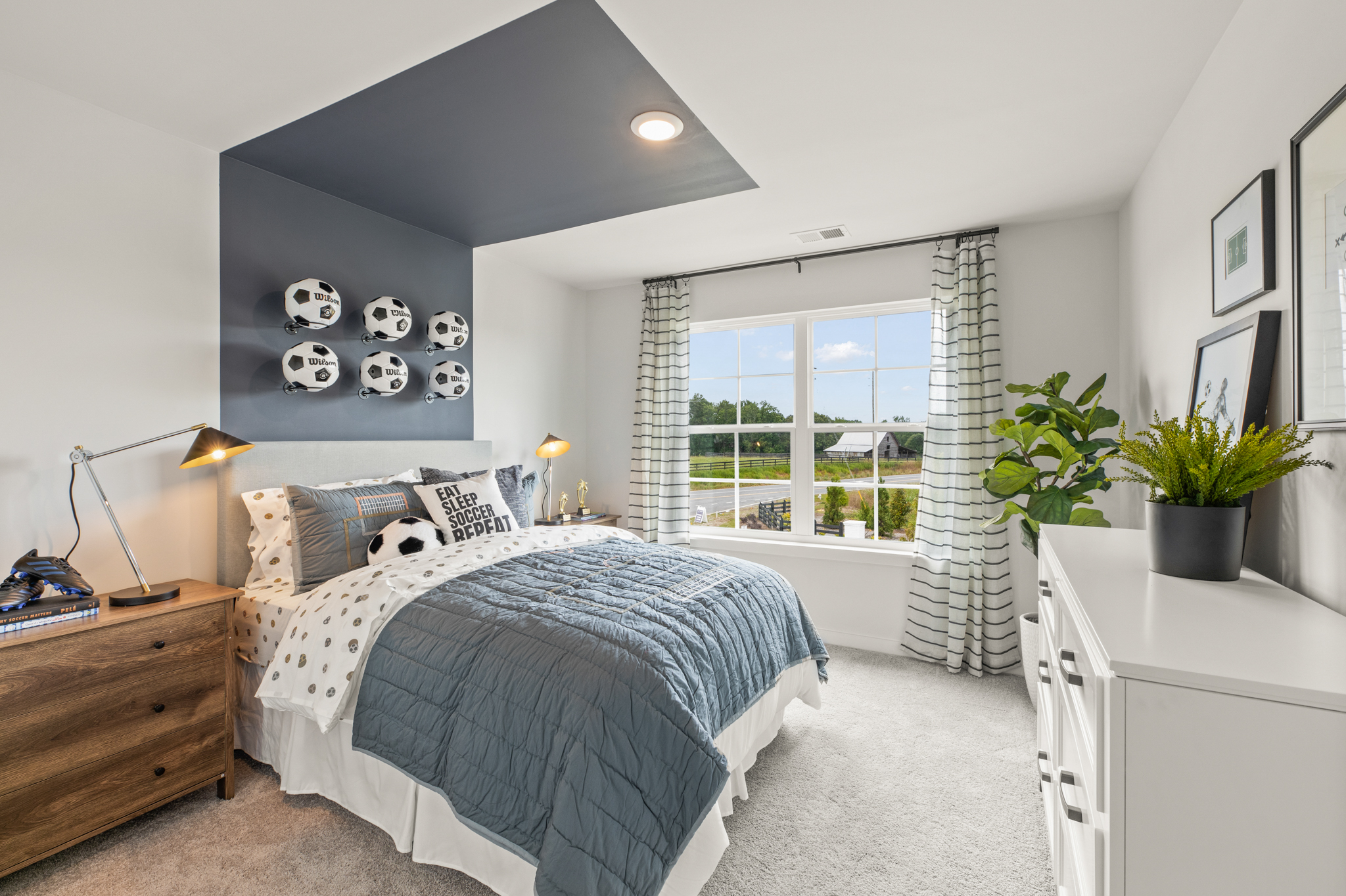 A bedroom with a bed and a window.