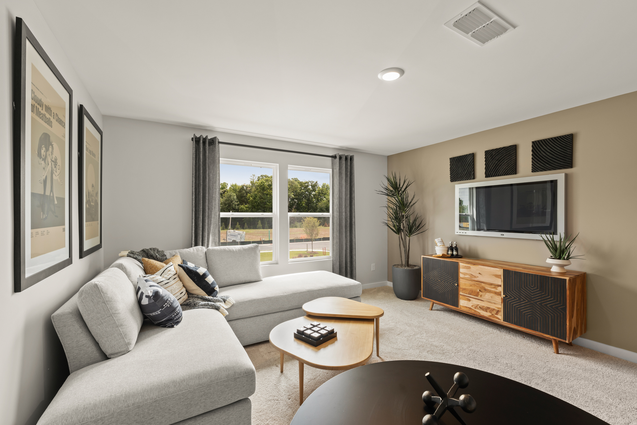 A living room with a tv and couches.