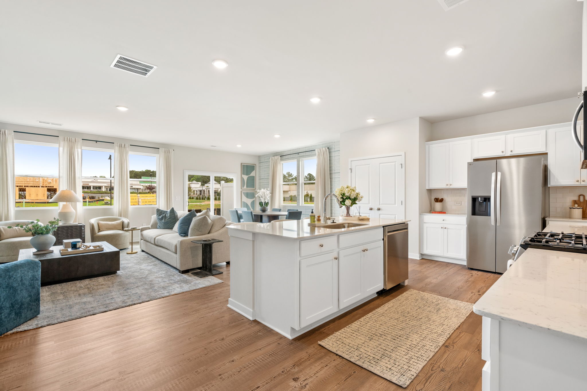 A large kitchen with white cabinets.