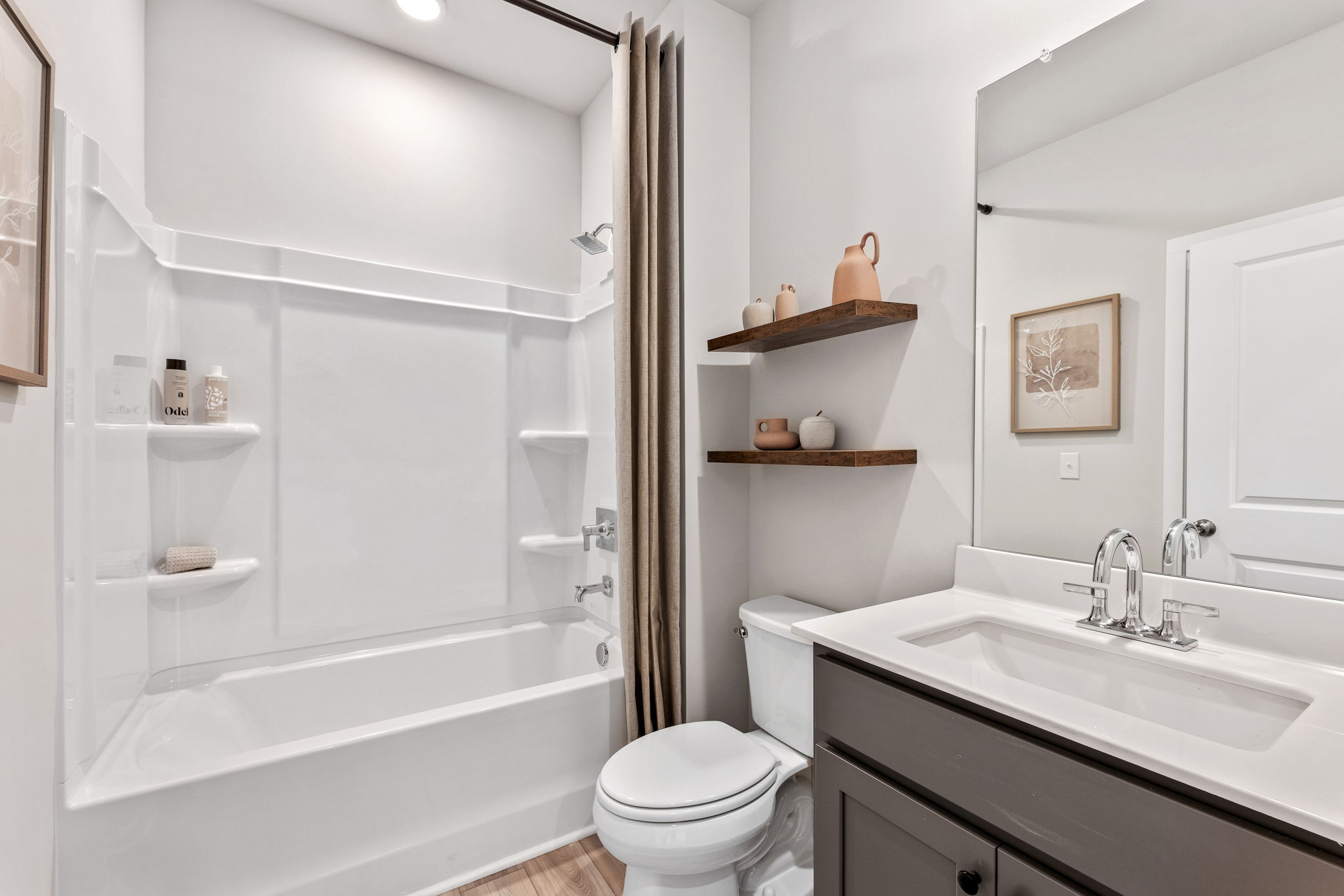 A bathroom with a tub toilet and sink.