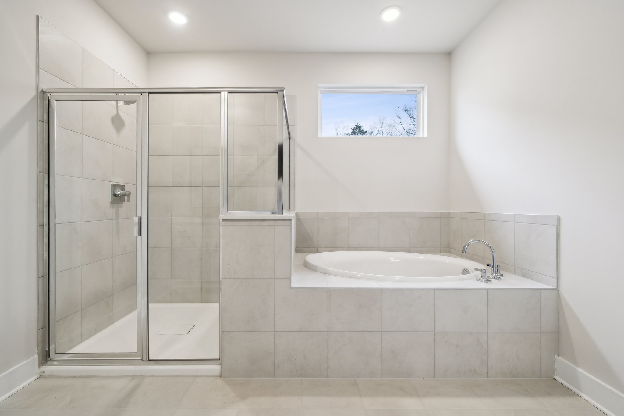 A bathroom with a glass shower.
