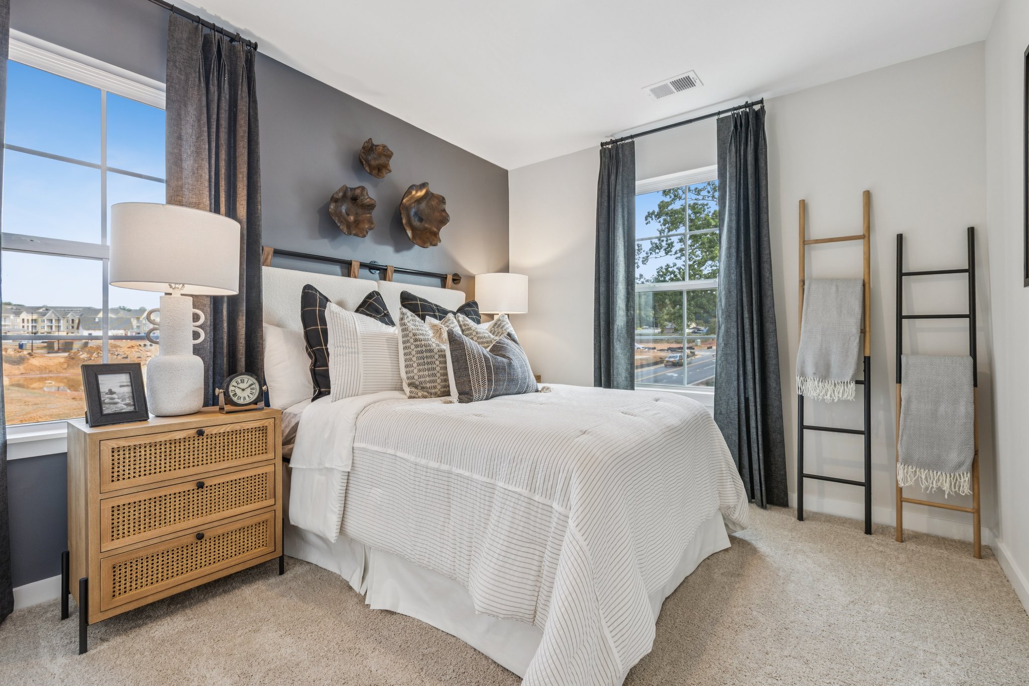 A bedroom with a bed and a window.