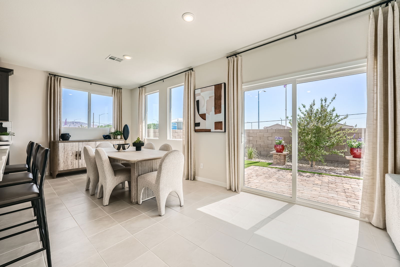 A large room with a table and chairs.