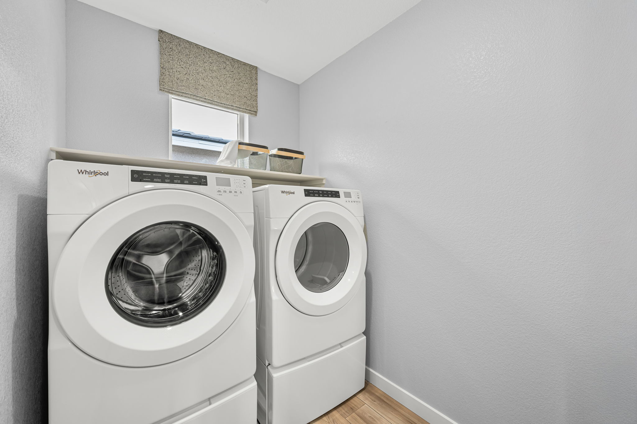 A washing machine in a room.