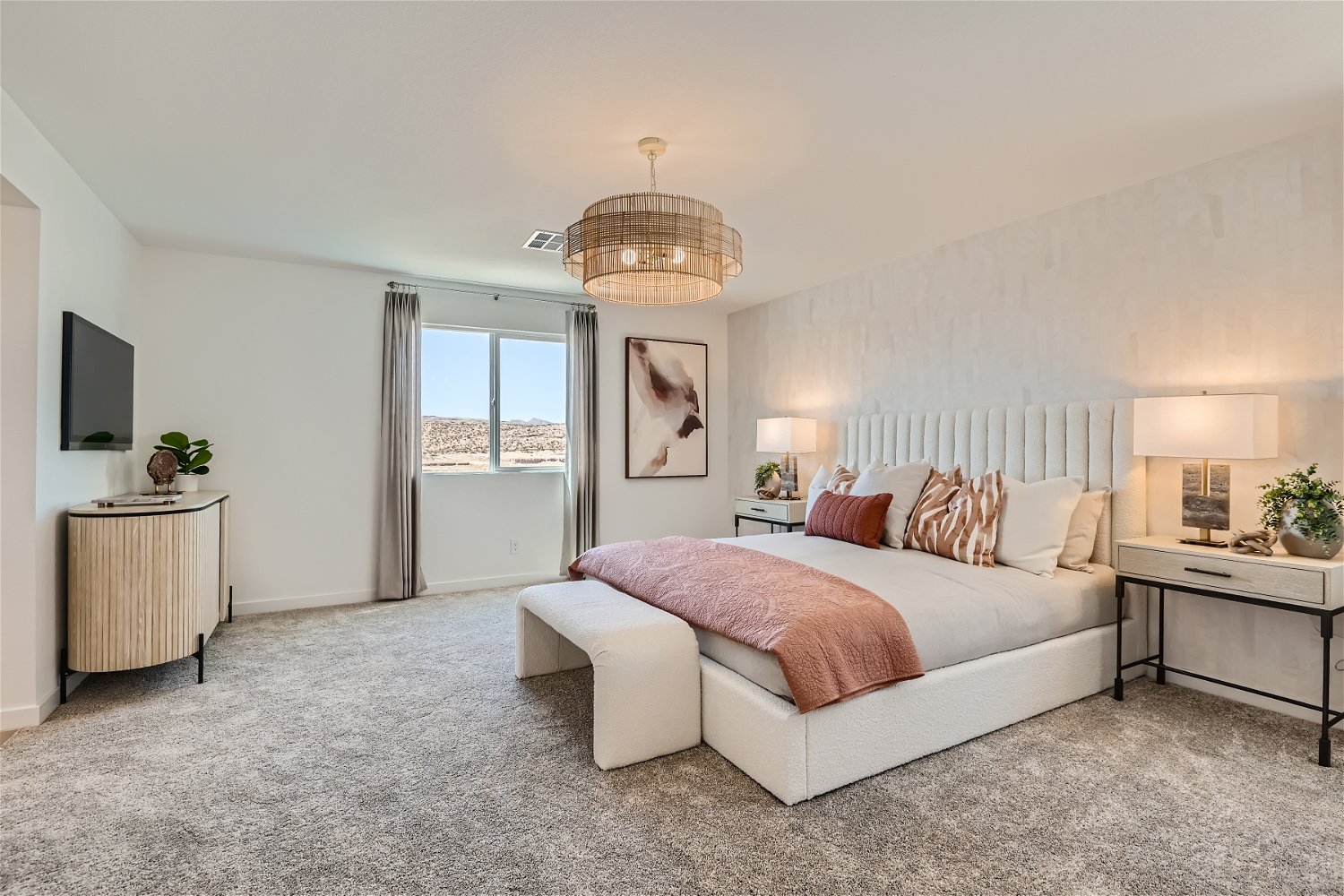 A bedroom with a bed and a table.