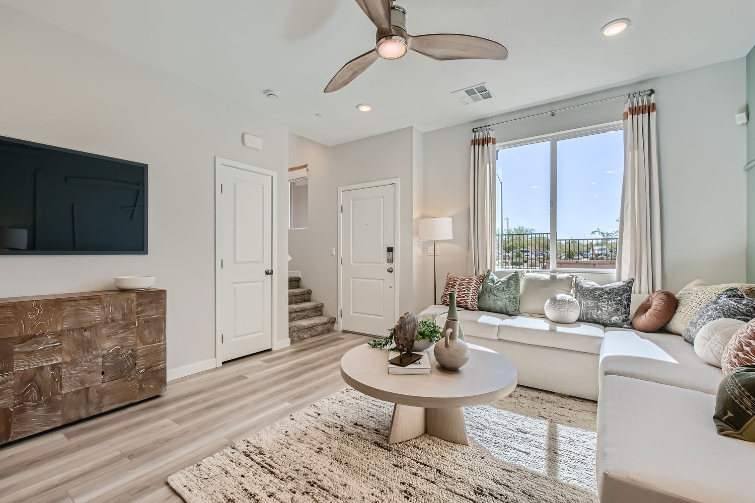 A living room with a large window.