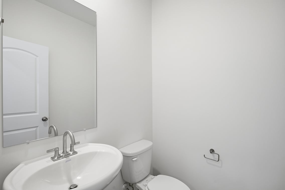 A bathroom with a sink and toilet.
