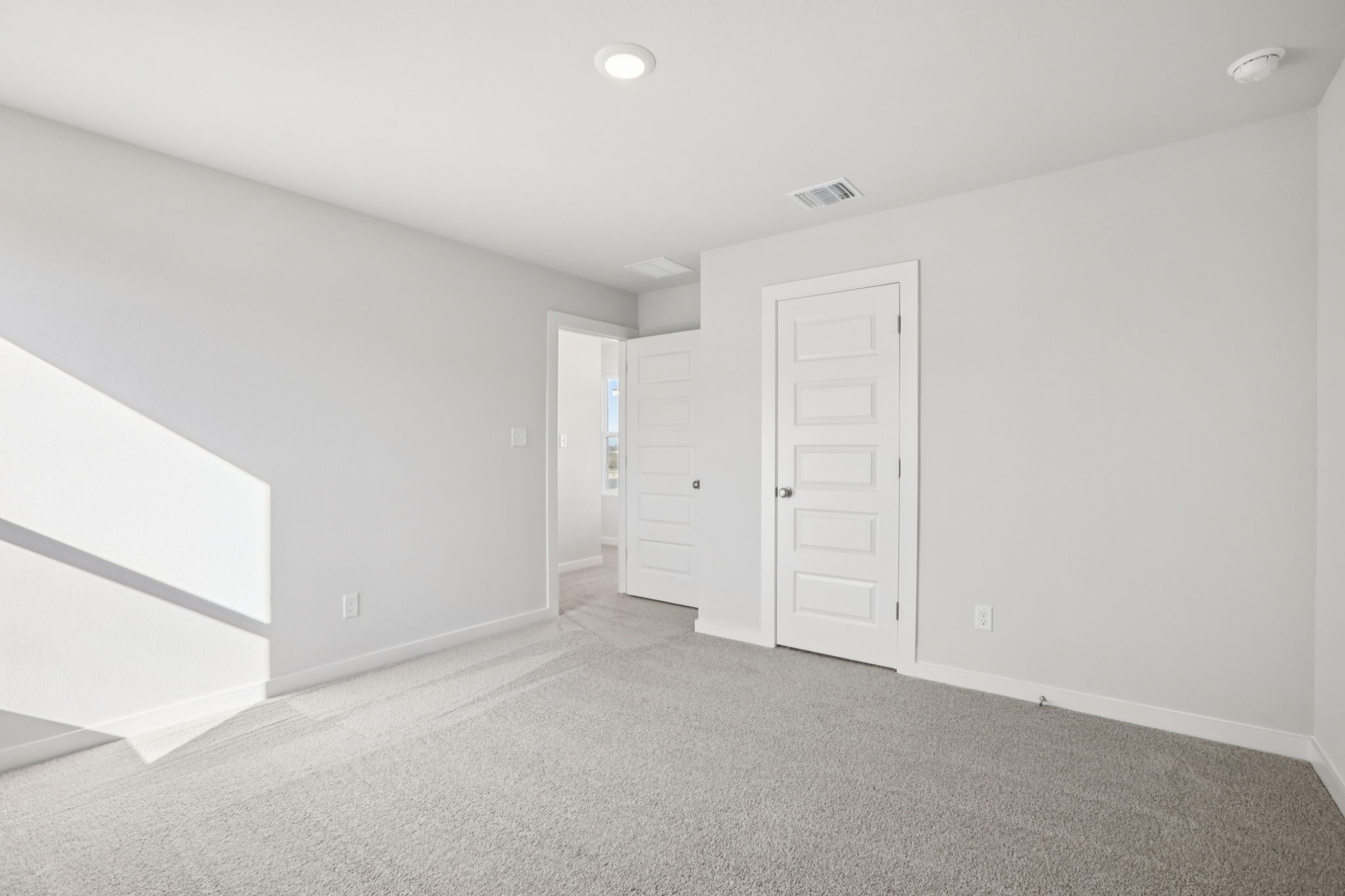 A room with white doors.