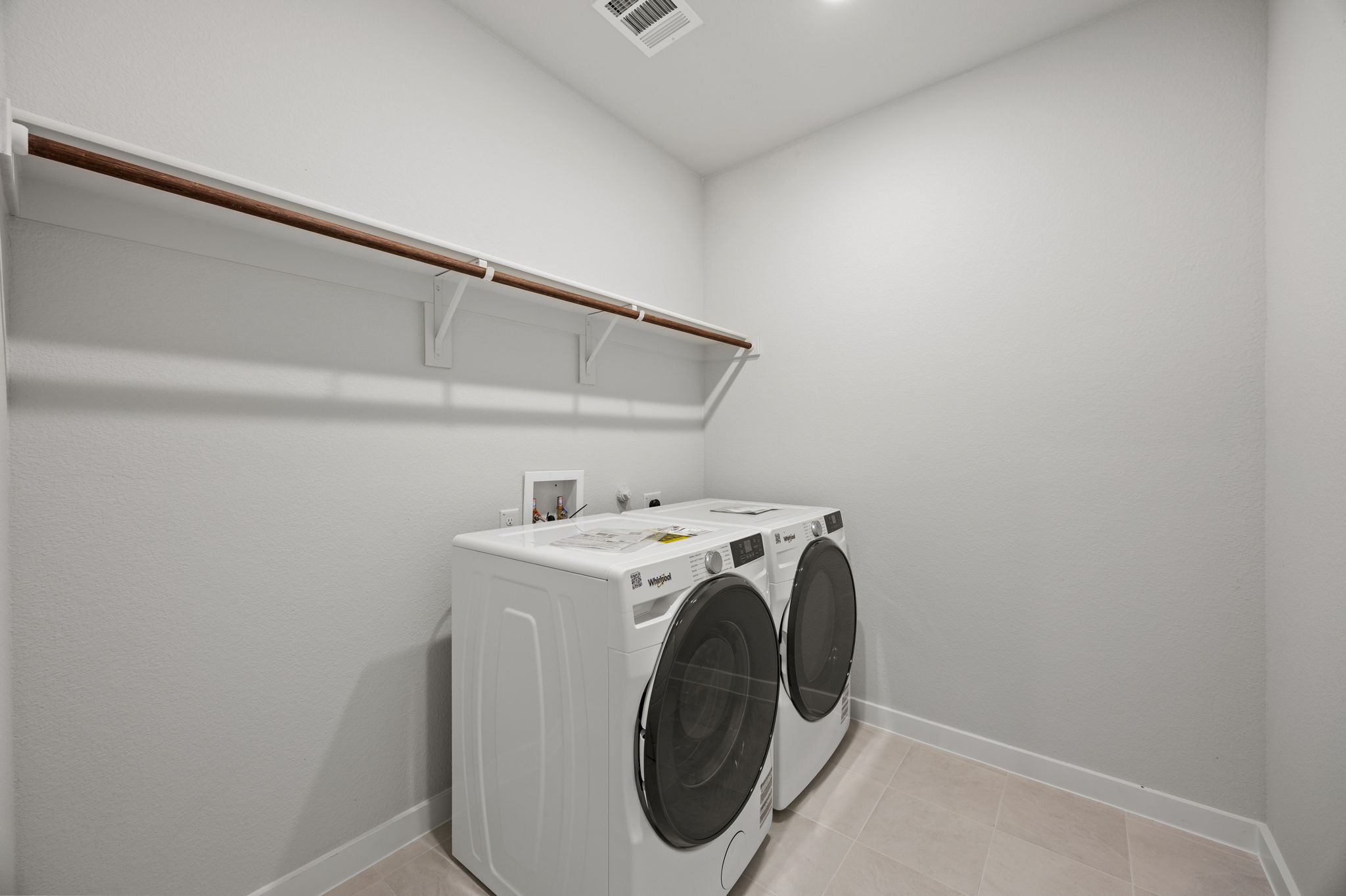 A white washing machine in a room.