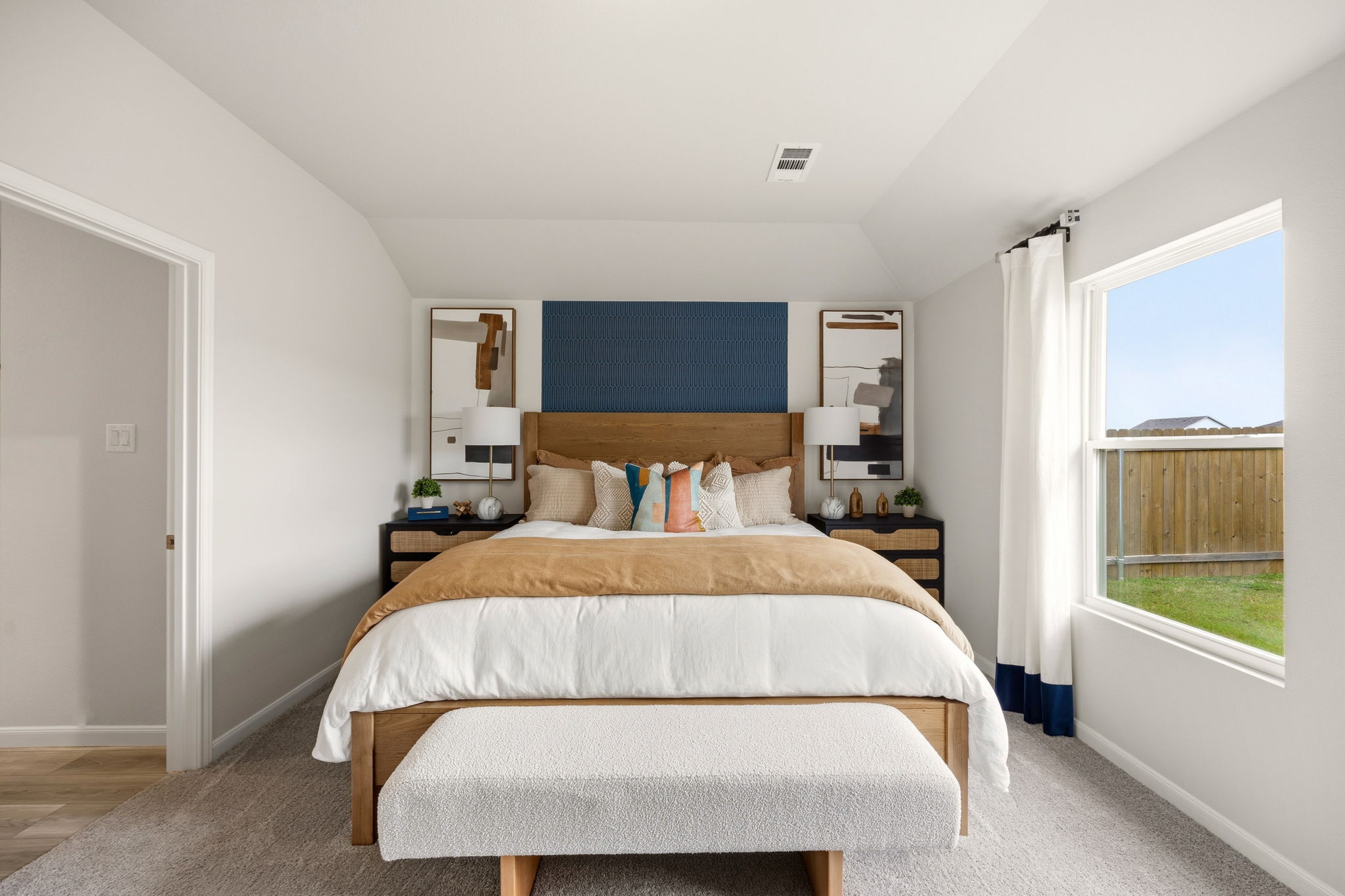 A bedroom with a large bed.