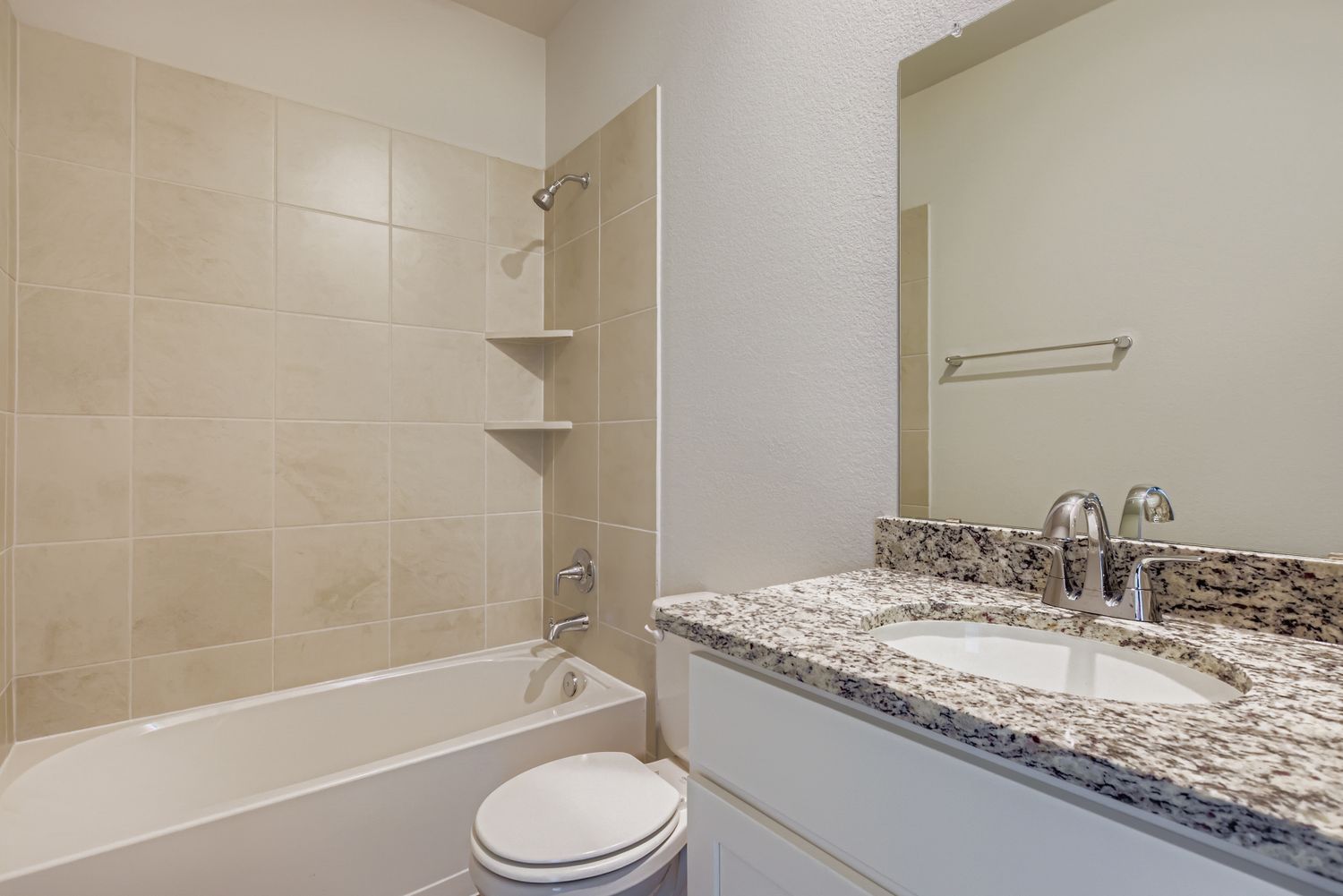A bathroom with a sink and a bathtub.
