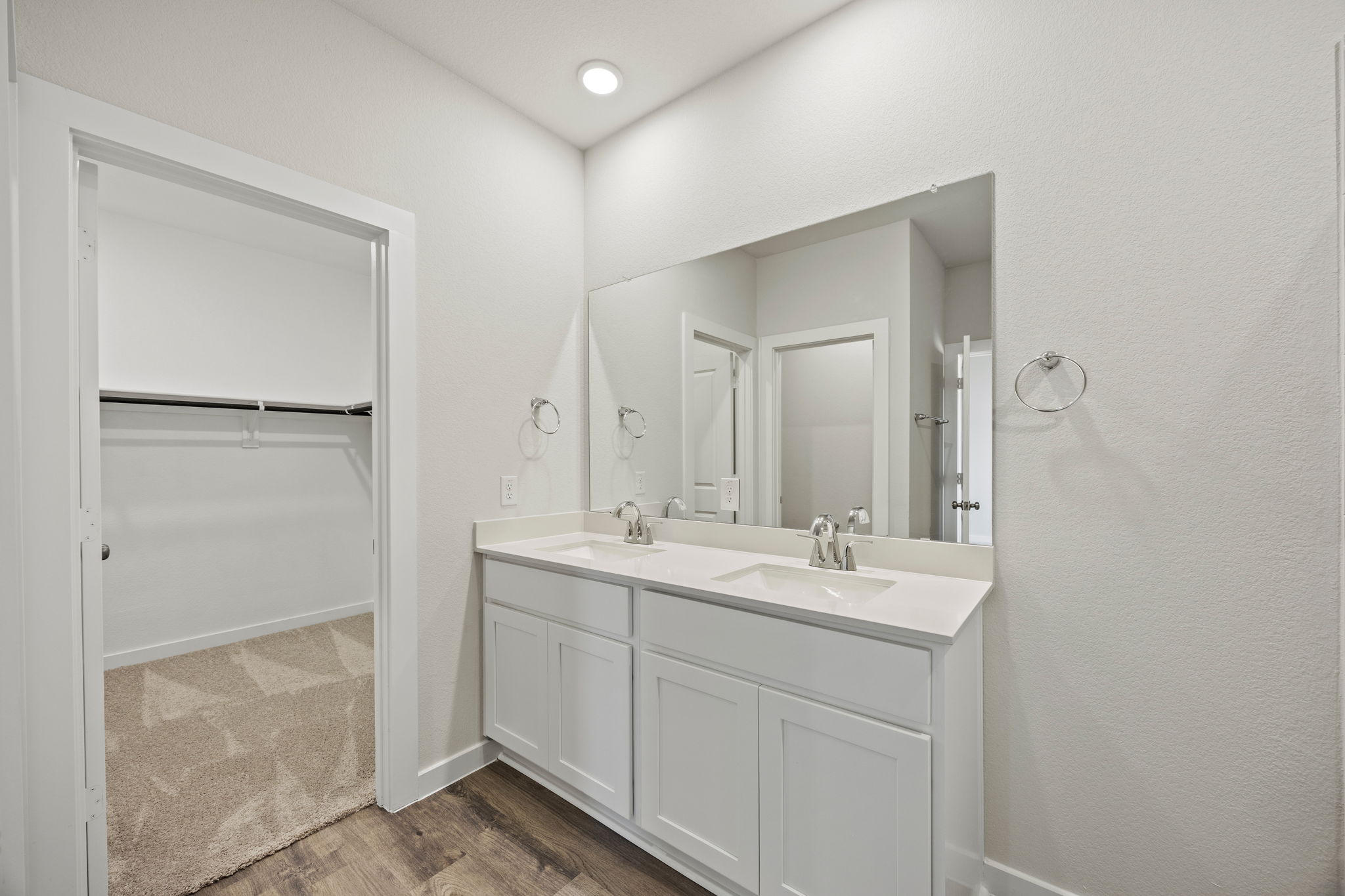 A bathroom with a sink and a shower.