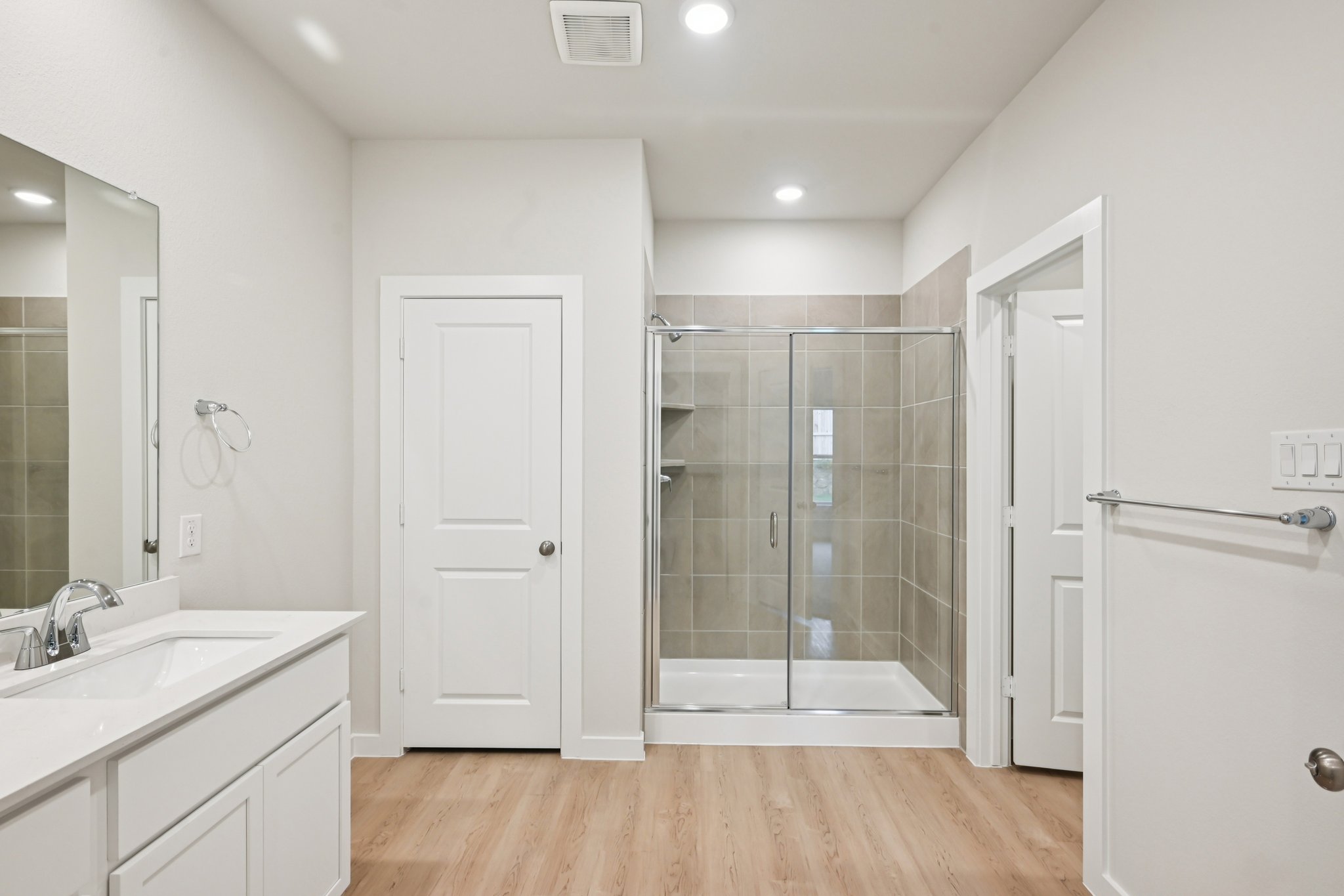 A bathroom with a glass shower.