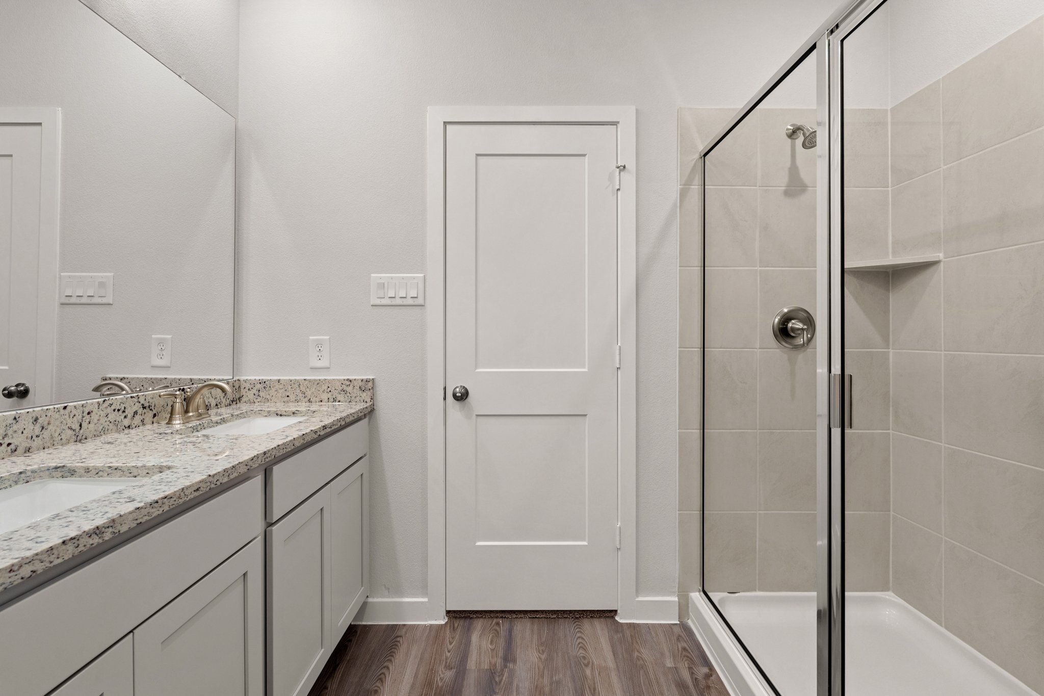 A bathroom with a glass shower.