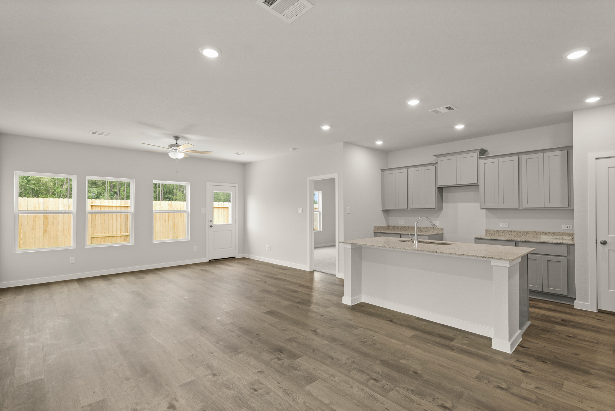 A large kitchen with white cabinets.