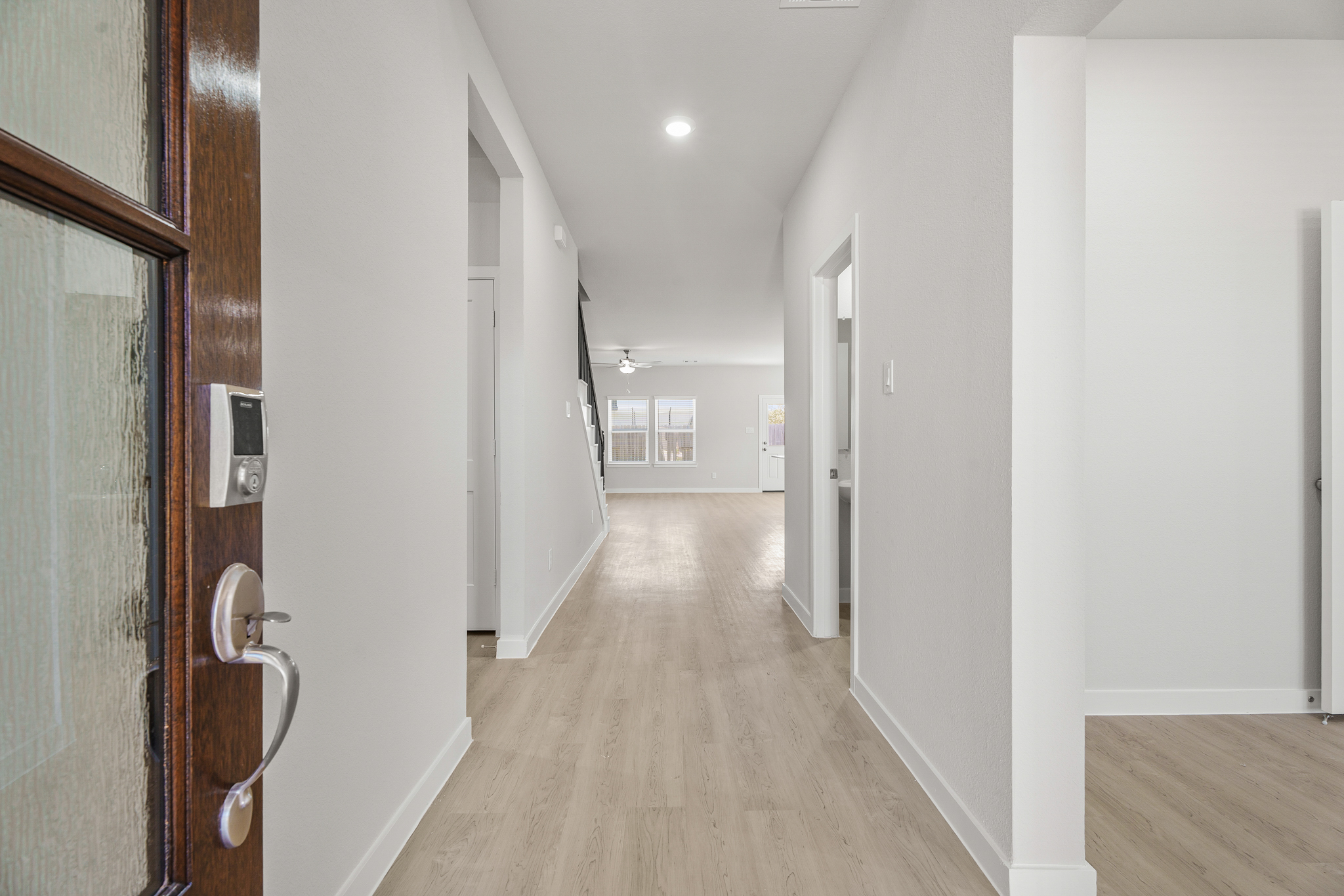 A hallway with white walls.