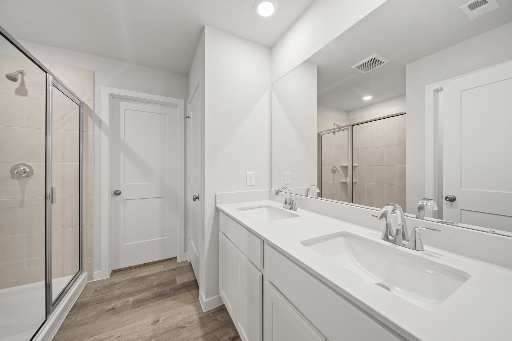 A bathroom with a glass shower.