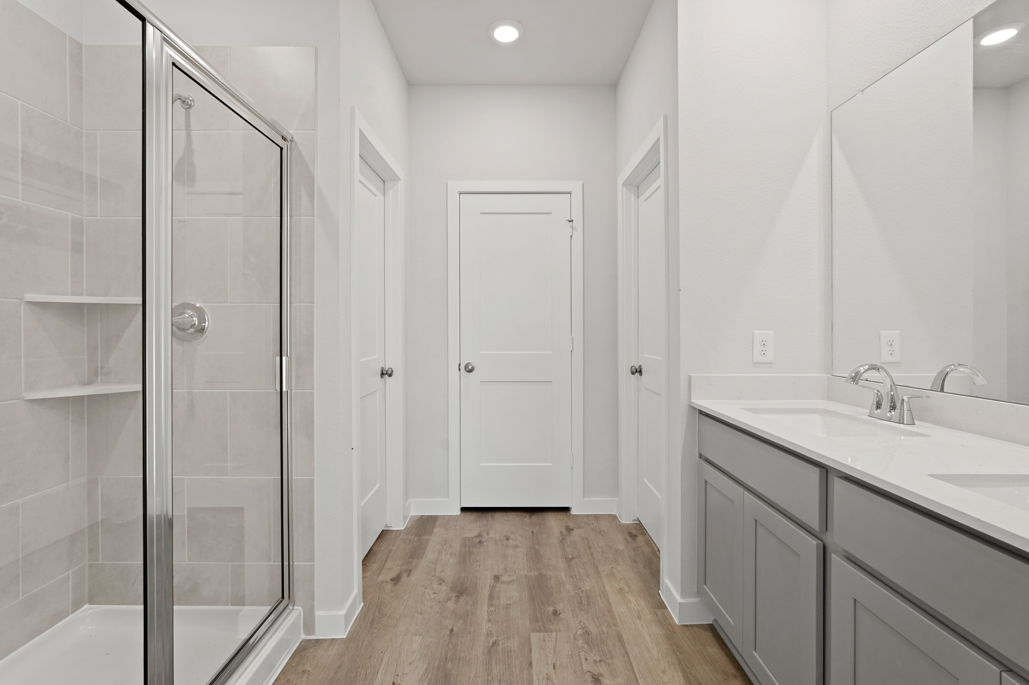 A bathroom with a glass shower.