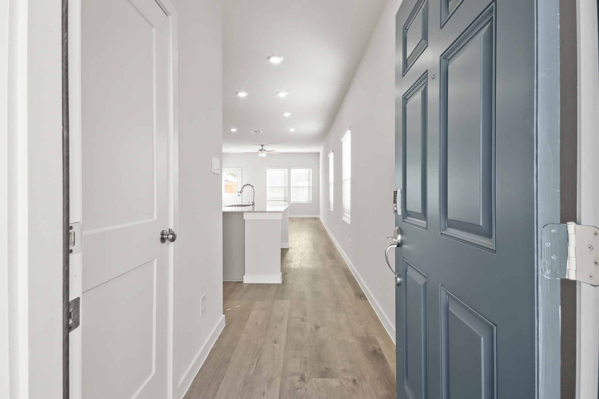 A hallway with blue doors.