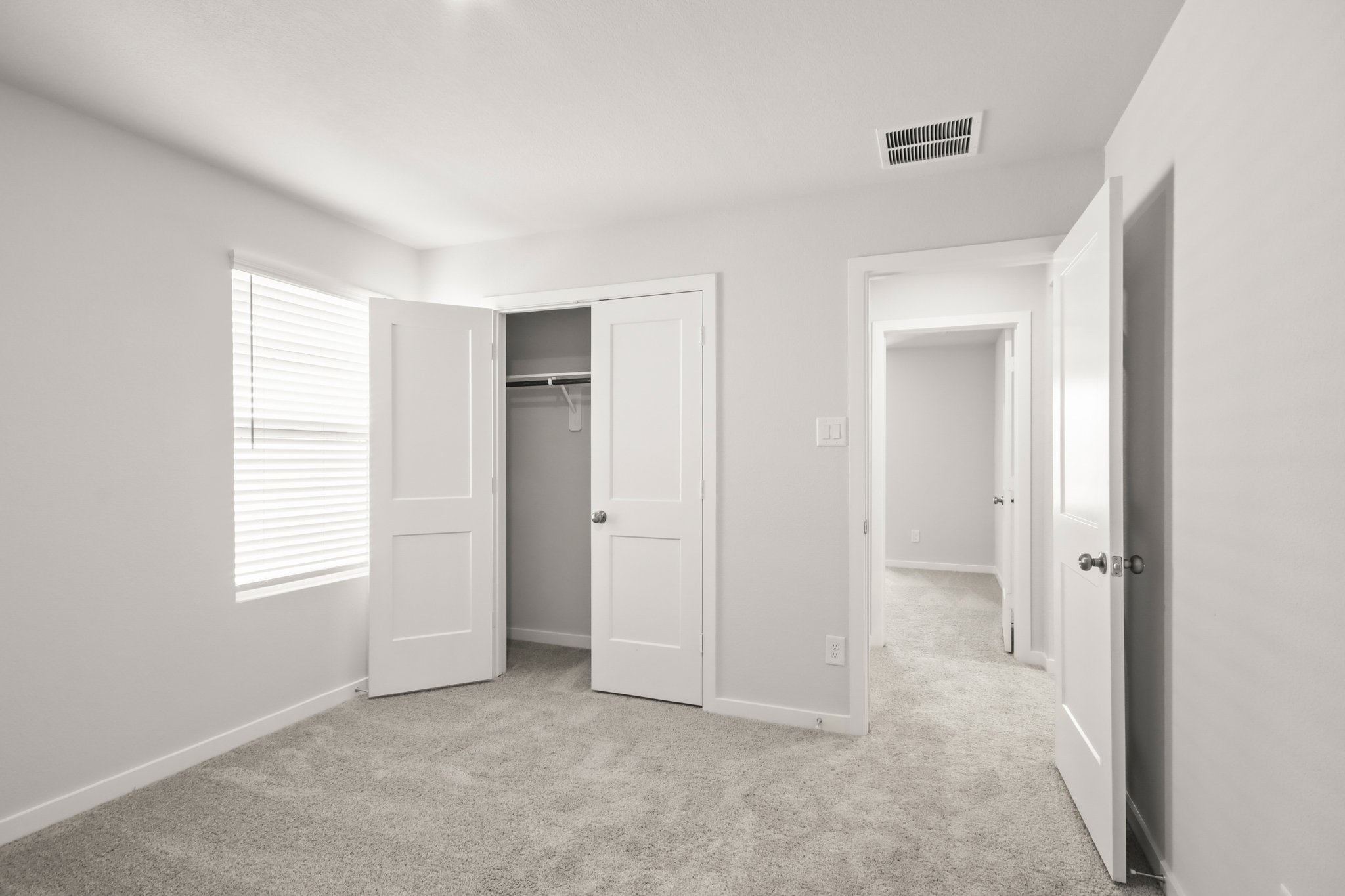 A room with white doors.