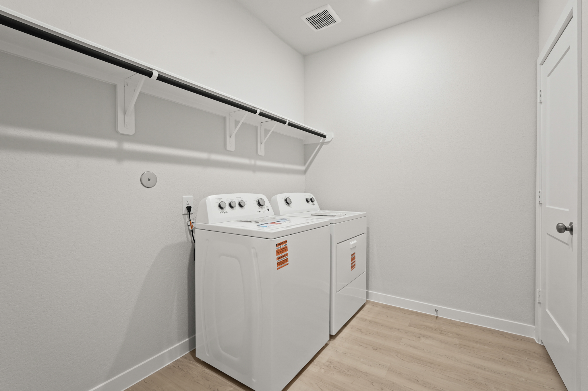 A white washing machine in a room.